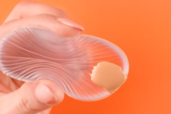 Close-up of a silicone sponge on a plain background.